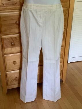 Women’s pants, size 9, colour white with blue and black stripes.
